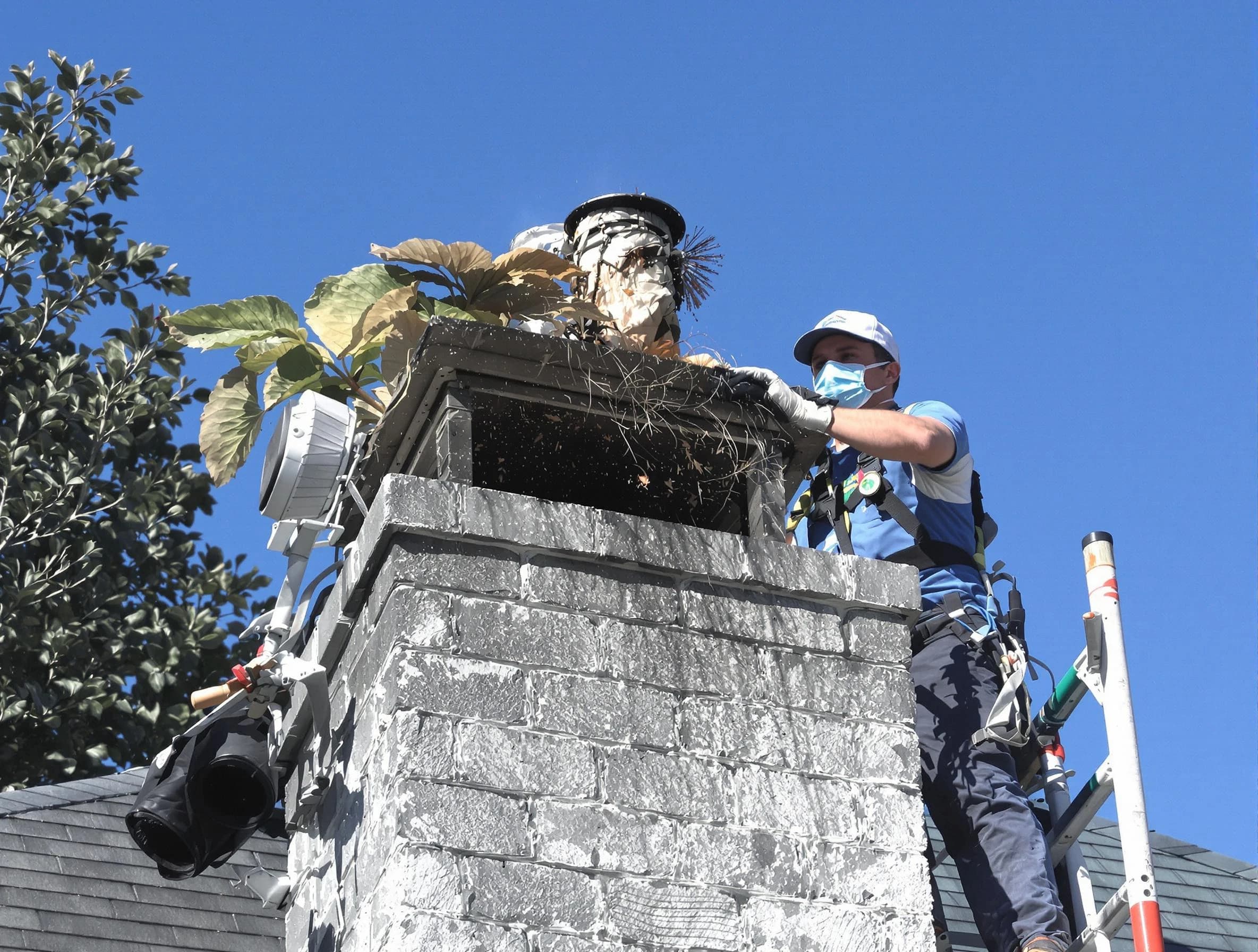 Monroe Chimney Sweep specialist performing chimney cleaning in Monroe, NJ